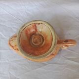 Vintage candle holder in the shape of a stylized Aladdin lamp