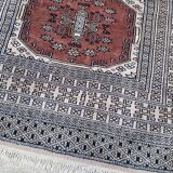 Vintage hand knotted rug with geometric patterns on a grey/beige/terracotta background 170 x 96 cm