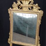 Louis XVI period mirror in gilded carved wood