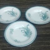 Set of three iron earthenware plates from the St Amandinoise earthenware factory, lily of the valley model.
