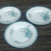 Set of three iron earthenware plates from the St Amandinoise earthenware factory, lily of the valley model.