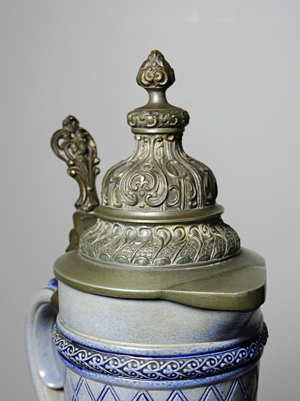 Large salt-glazed stoneware beer jug with tin, Germany, Westerwald type.