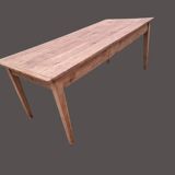 Old farmhouse table with two drawers.