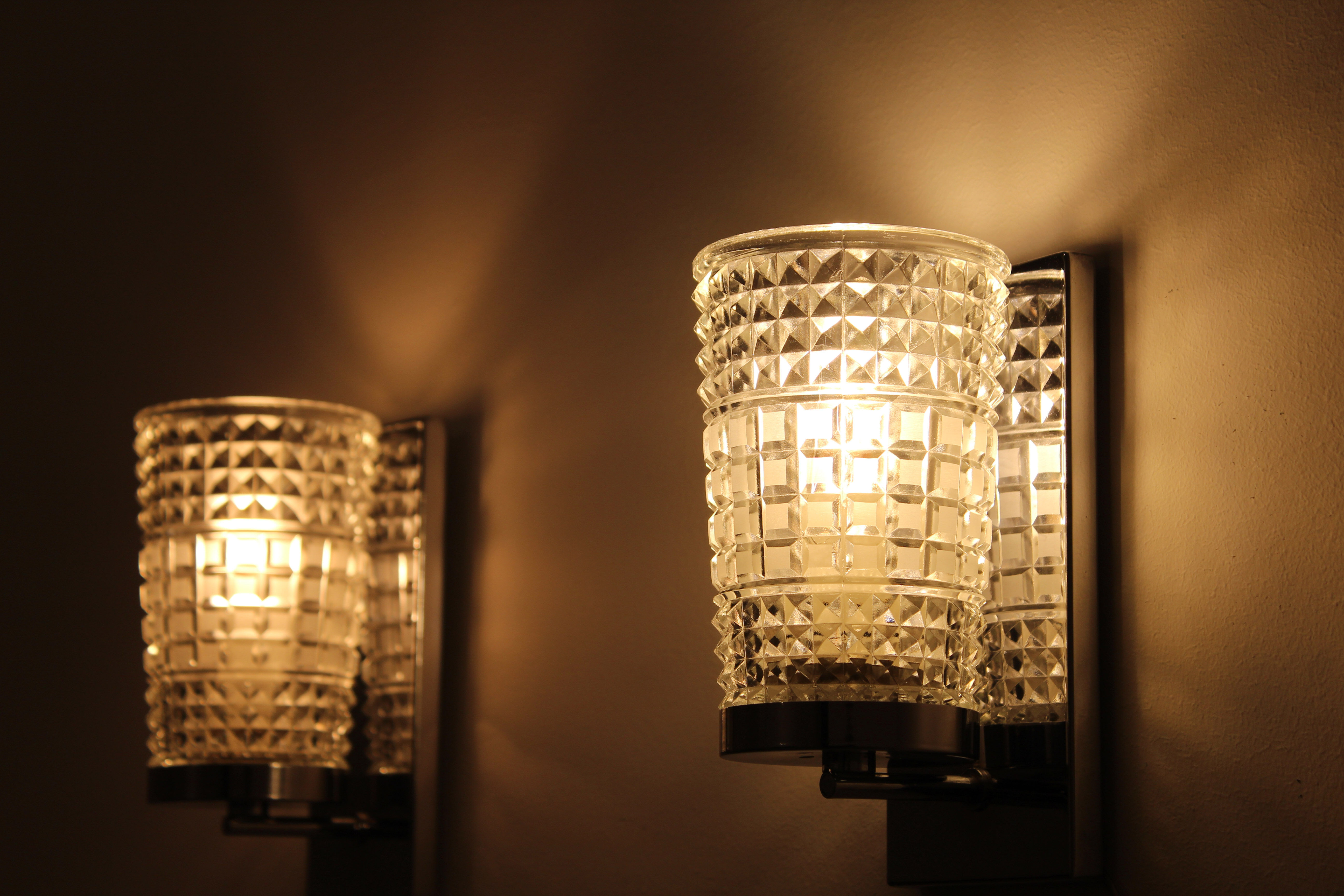 Wall lamps in worked glass and chromed metal, Italy 70's