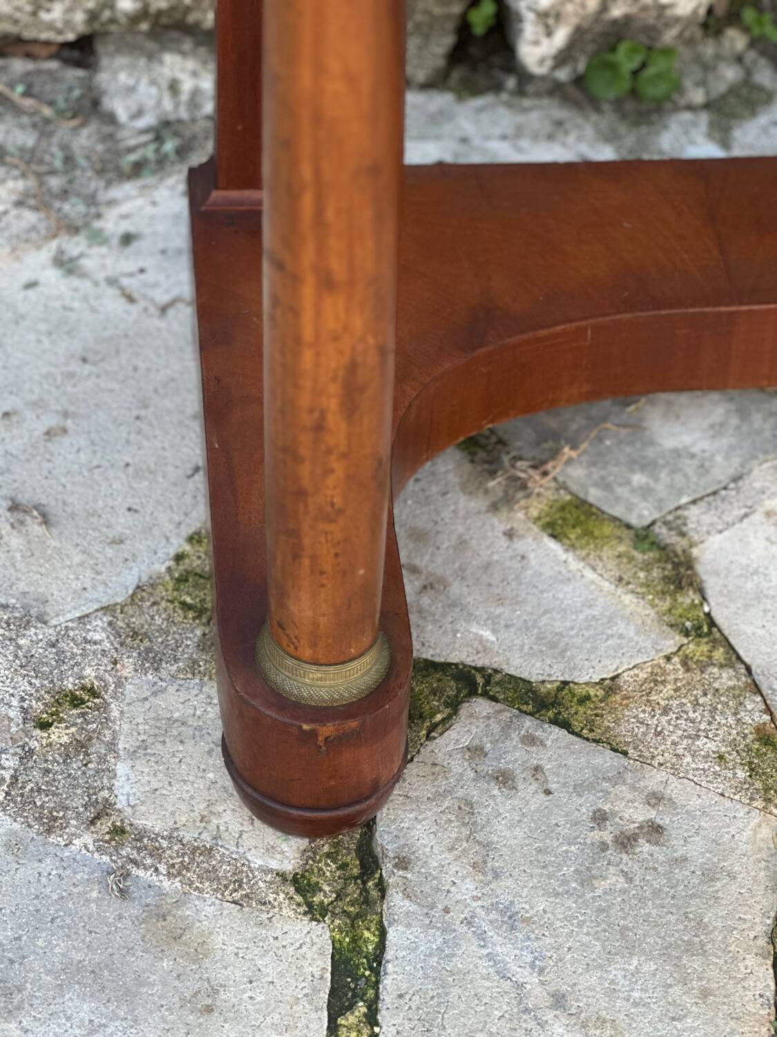 A small piece of Bonheur du jour with detached columns in Empire-era mahogany.