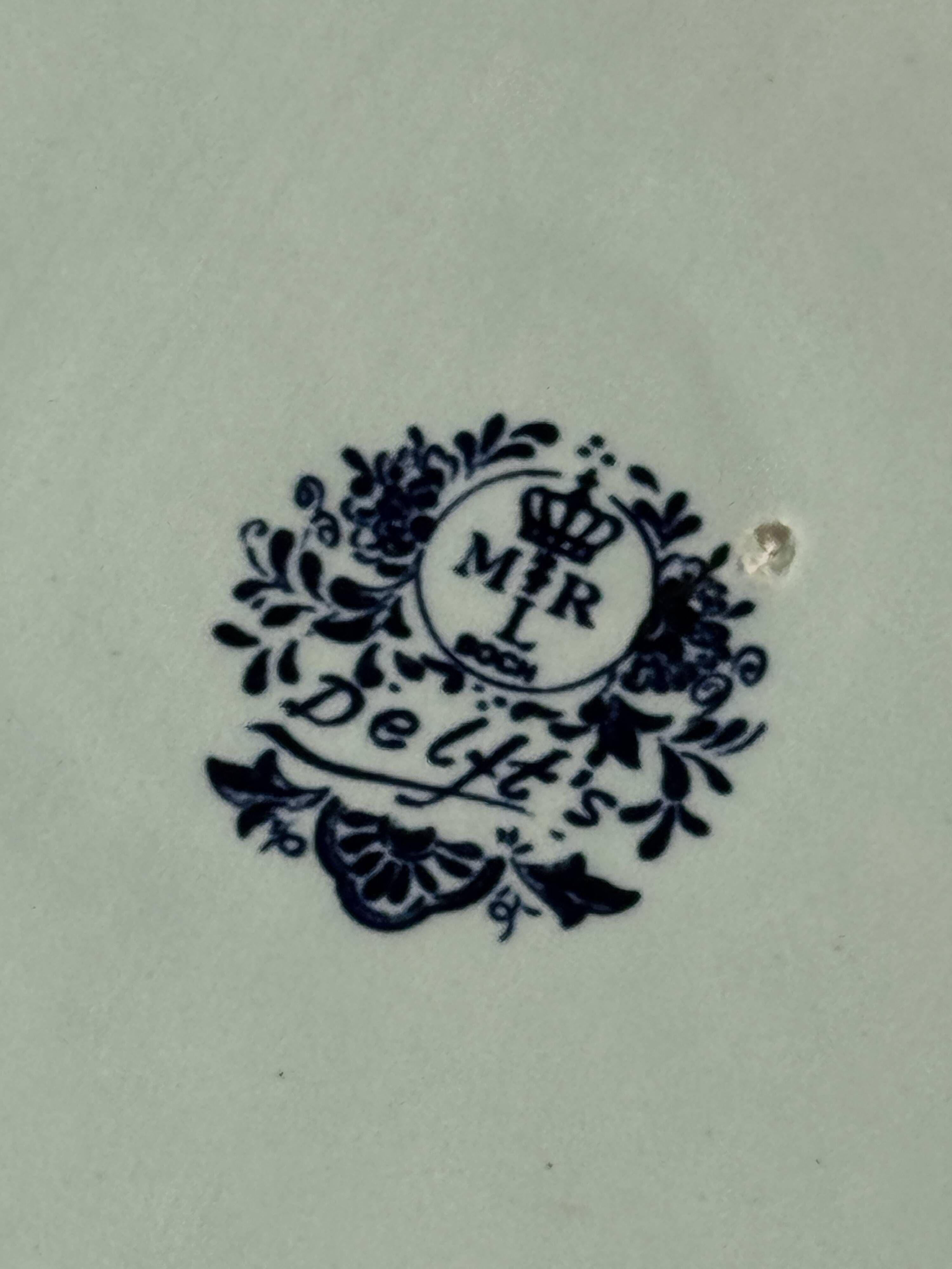 Vintage hollow circular plate in blue and white Boch pottery.