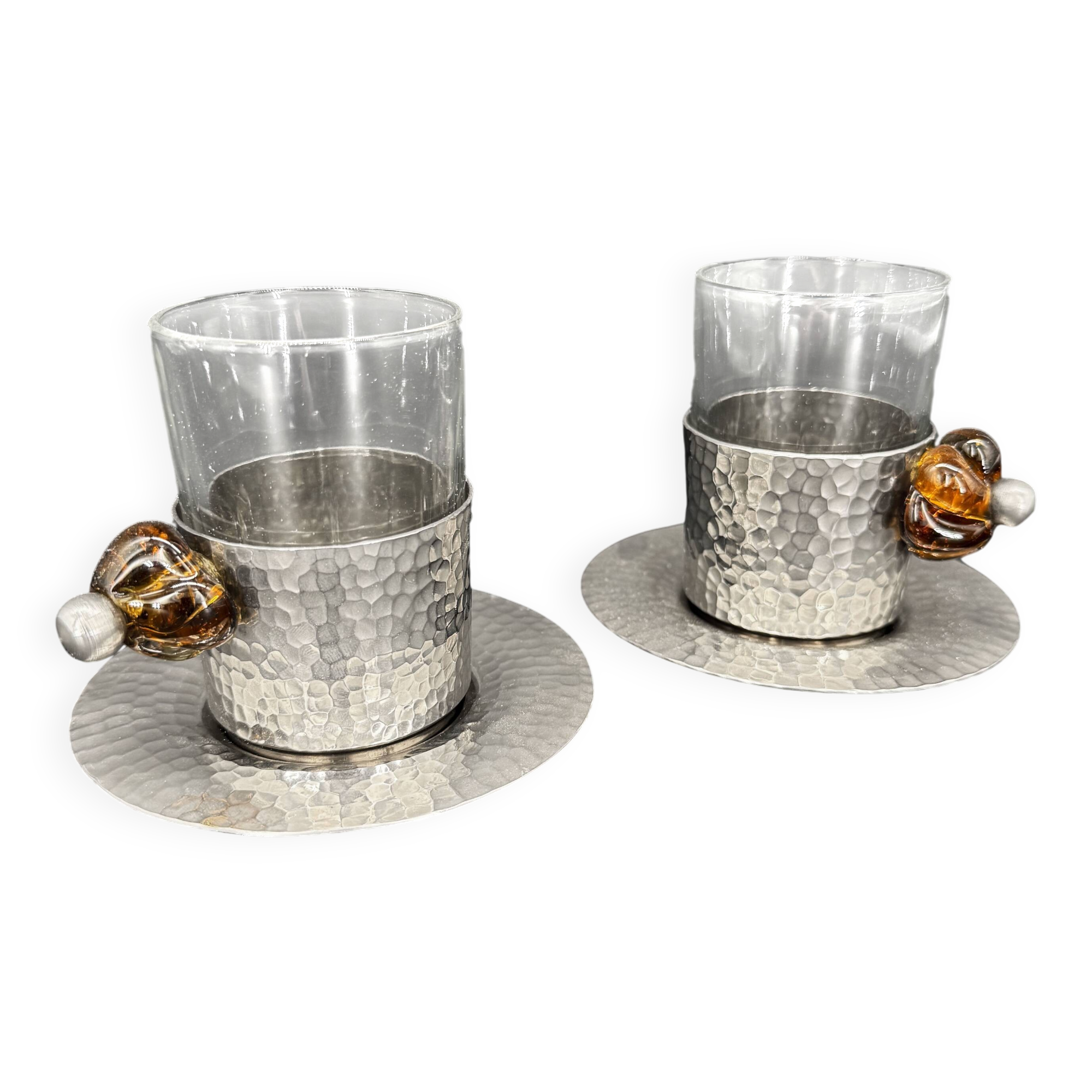 Duo of hammered metal and blown glass cups — handcrafted work