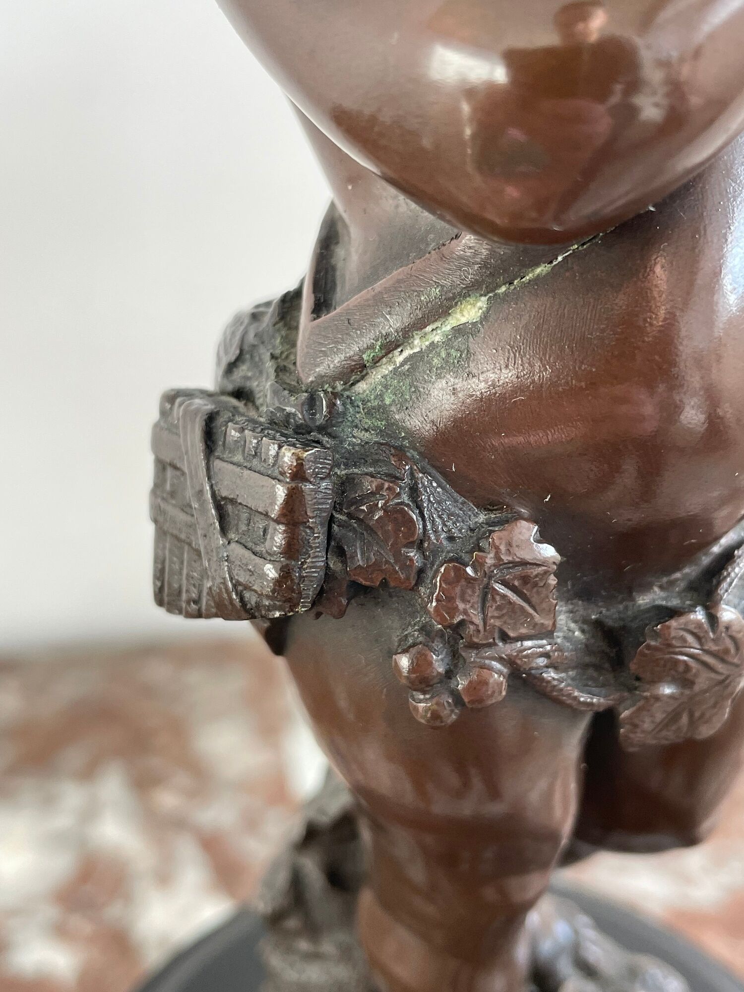 Candelabra with cherub in patinated bronze