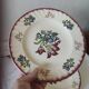 Set of 5 flat plates, signed Longwy.