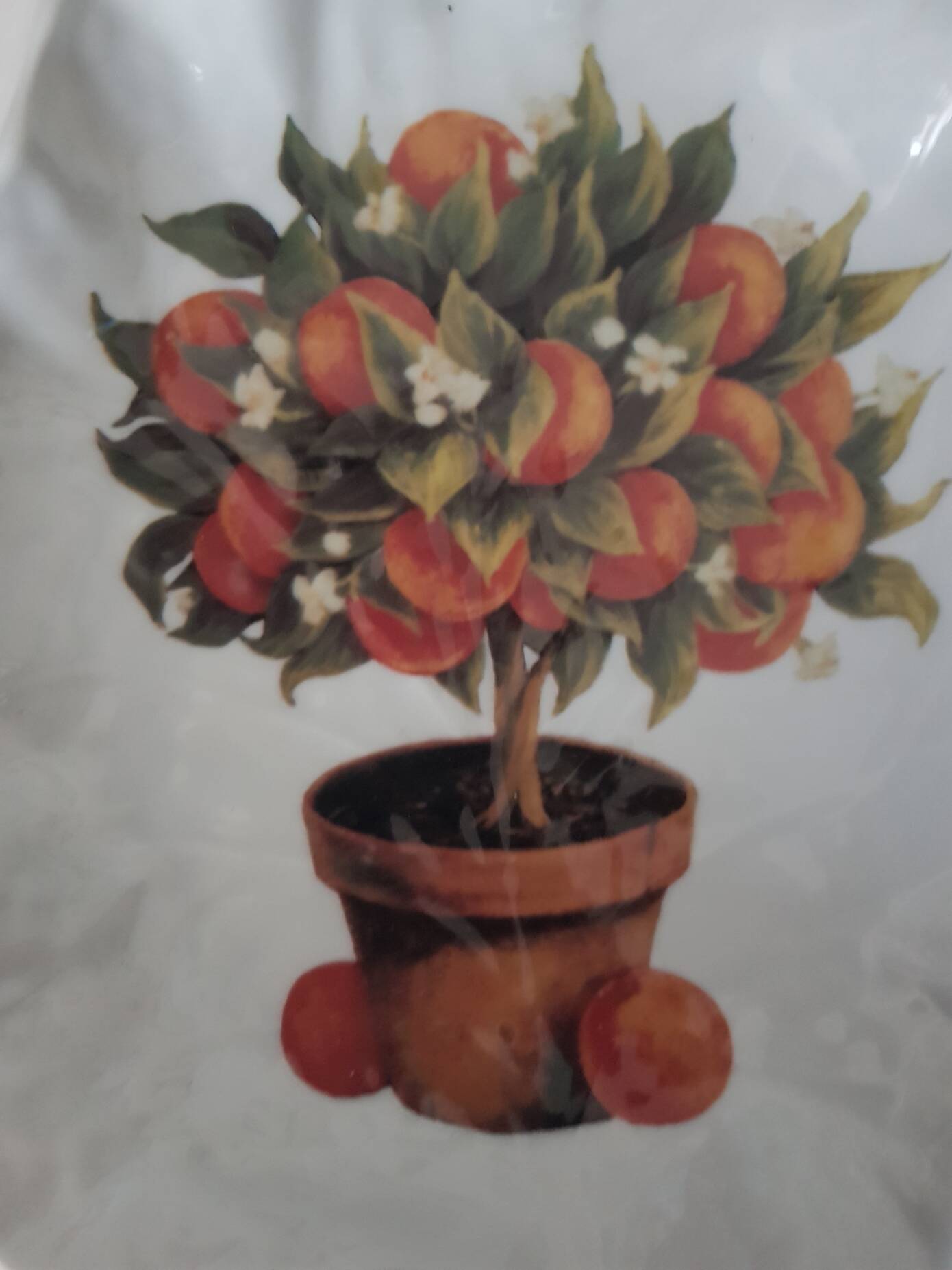 Porcelain vide poche from Limoges with orange decoration.