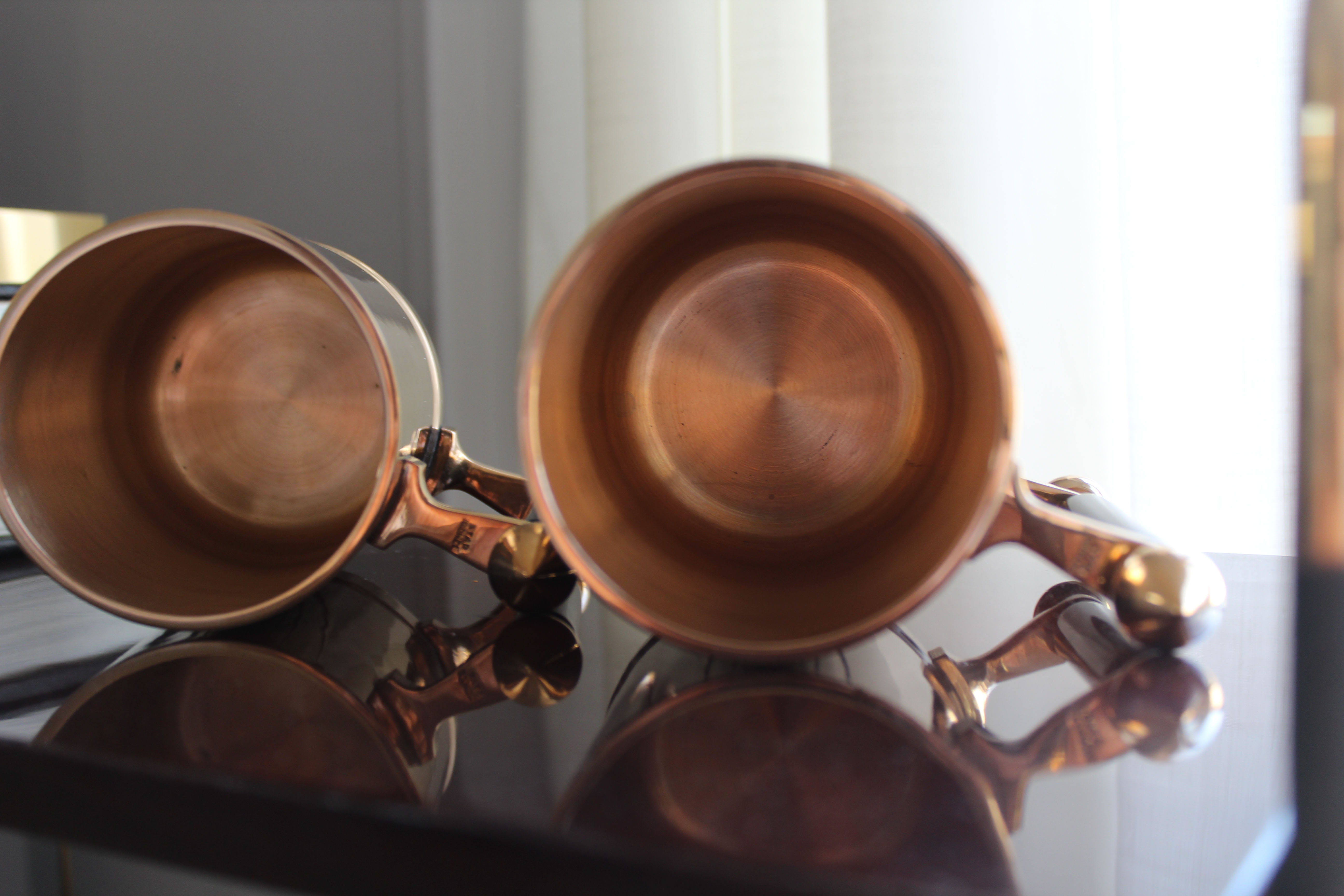 Pair of art deco bronze beer mugs France, 1940s, signed Bronze Star