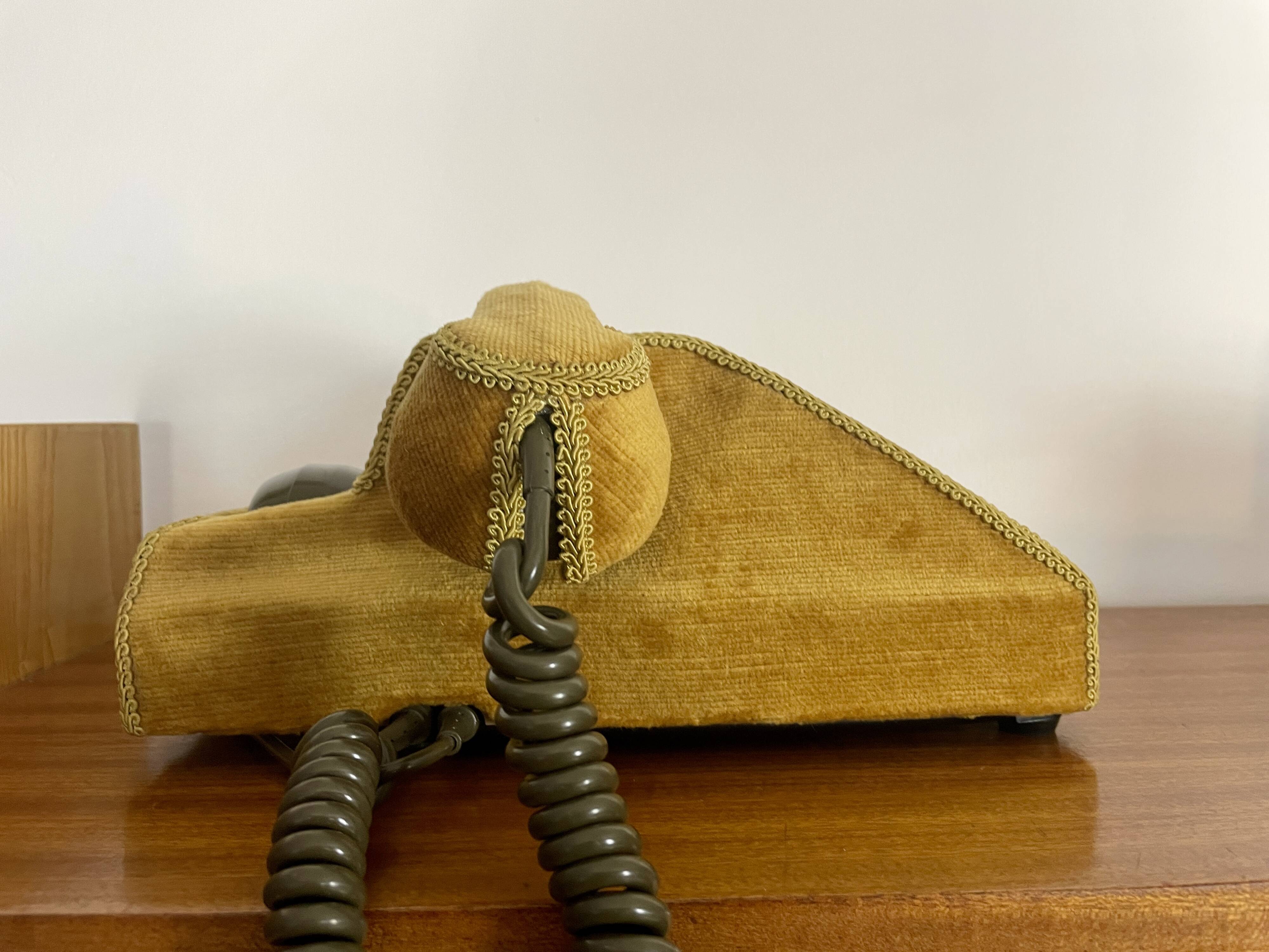 Socotel S63 telephone with its gold velvet shell