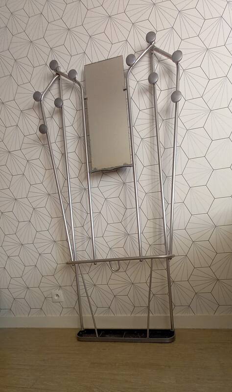 Vintage aluminum wall coat rack.