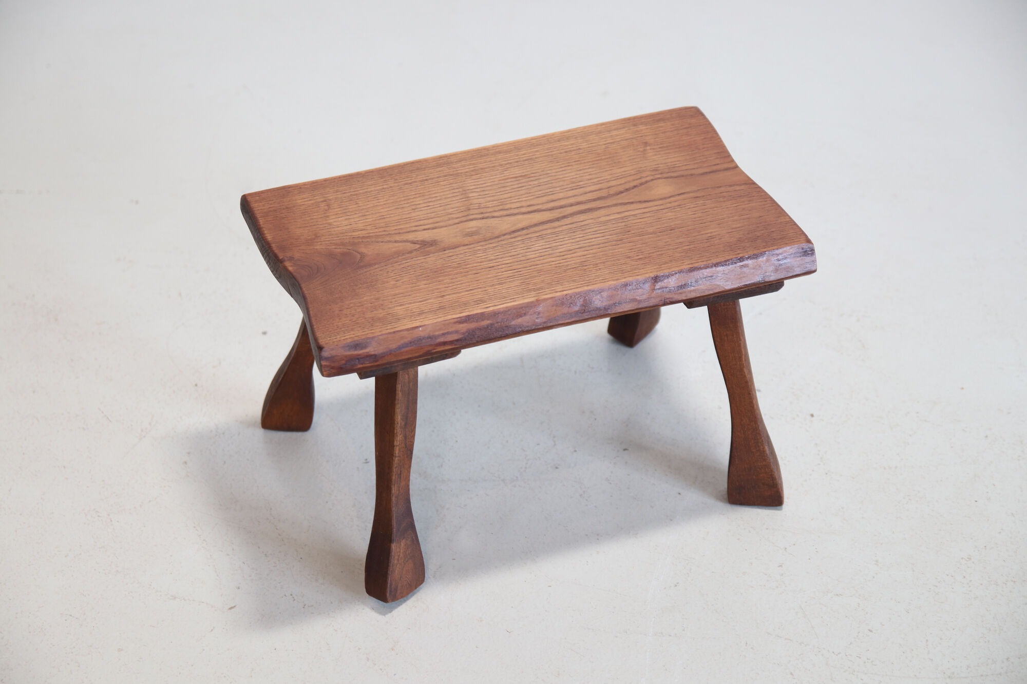 French brutalist tree trunk stools