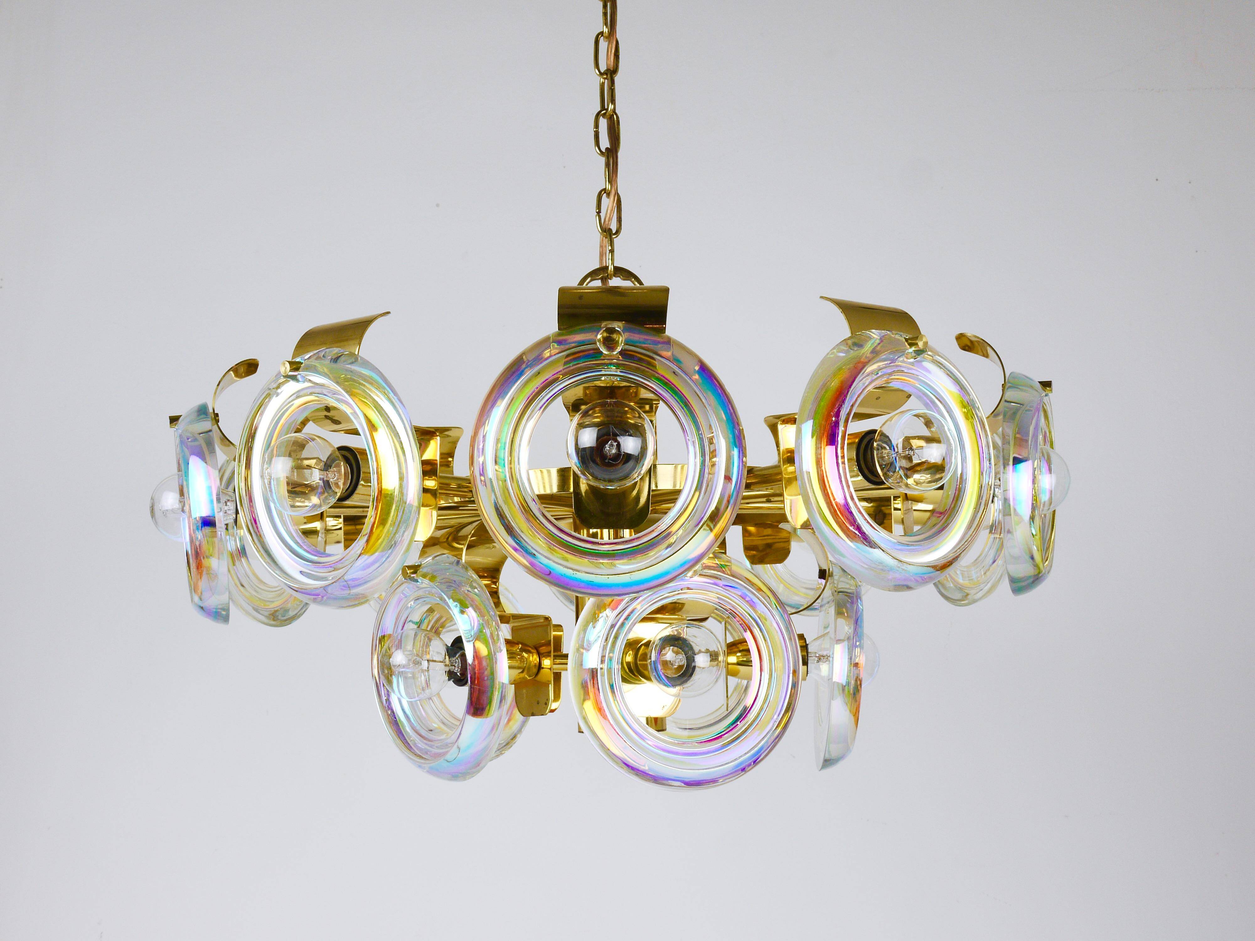 Large brass chandelier by Oscar Torlasco, rainbow optical glass rings, Italy, 1970s.