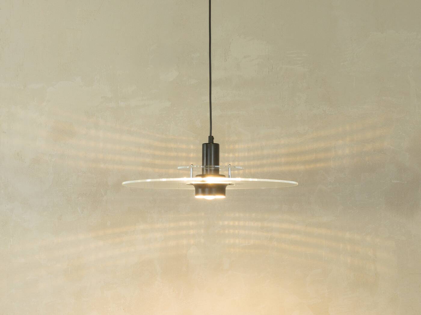 Space Age ceiling lamp by Ikea from the 1980s with two plexiglass plates and canopy made of black injection-moulded plastic.