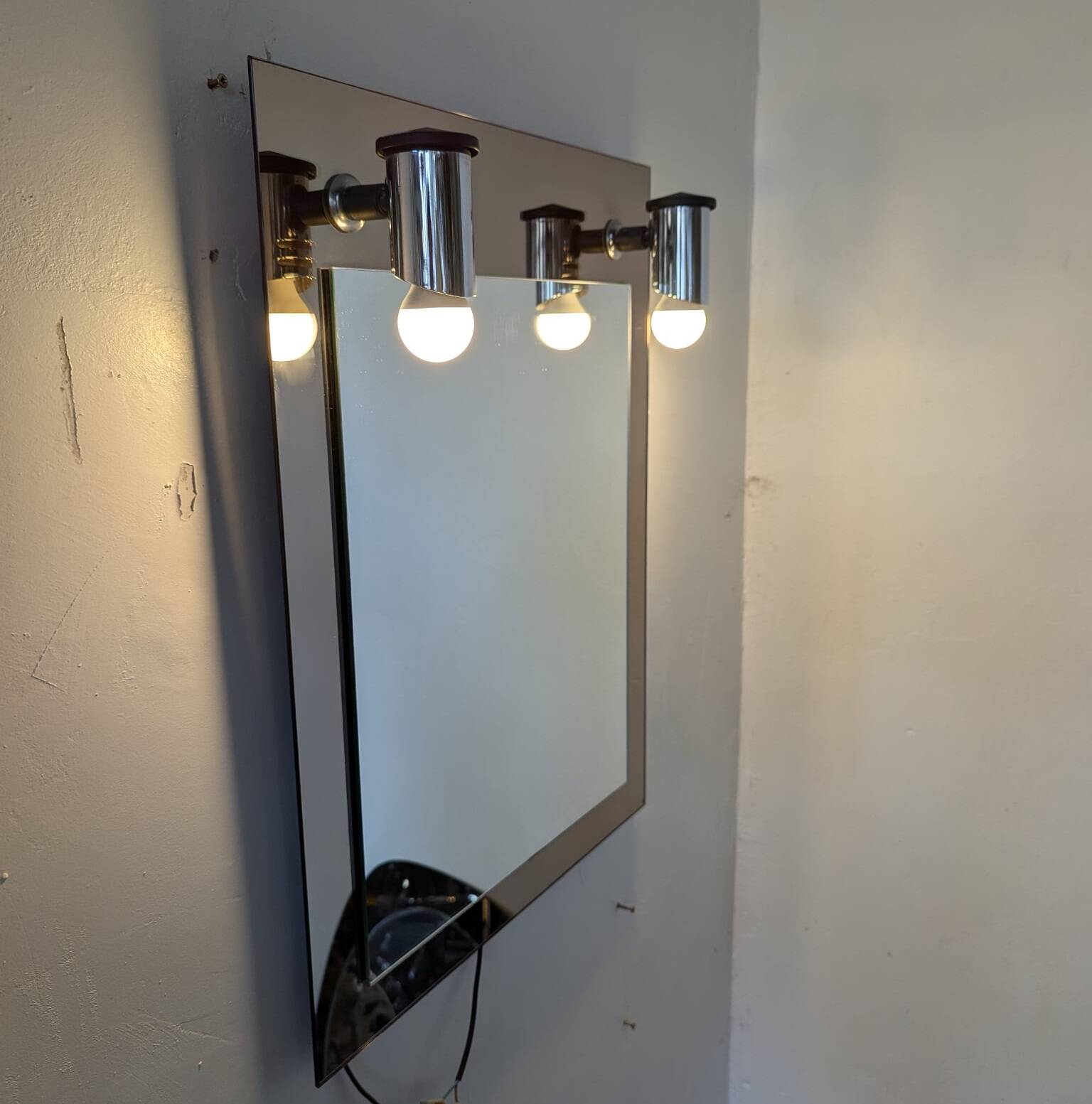 Vintage mirror with sconces.