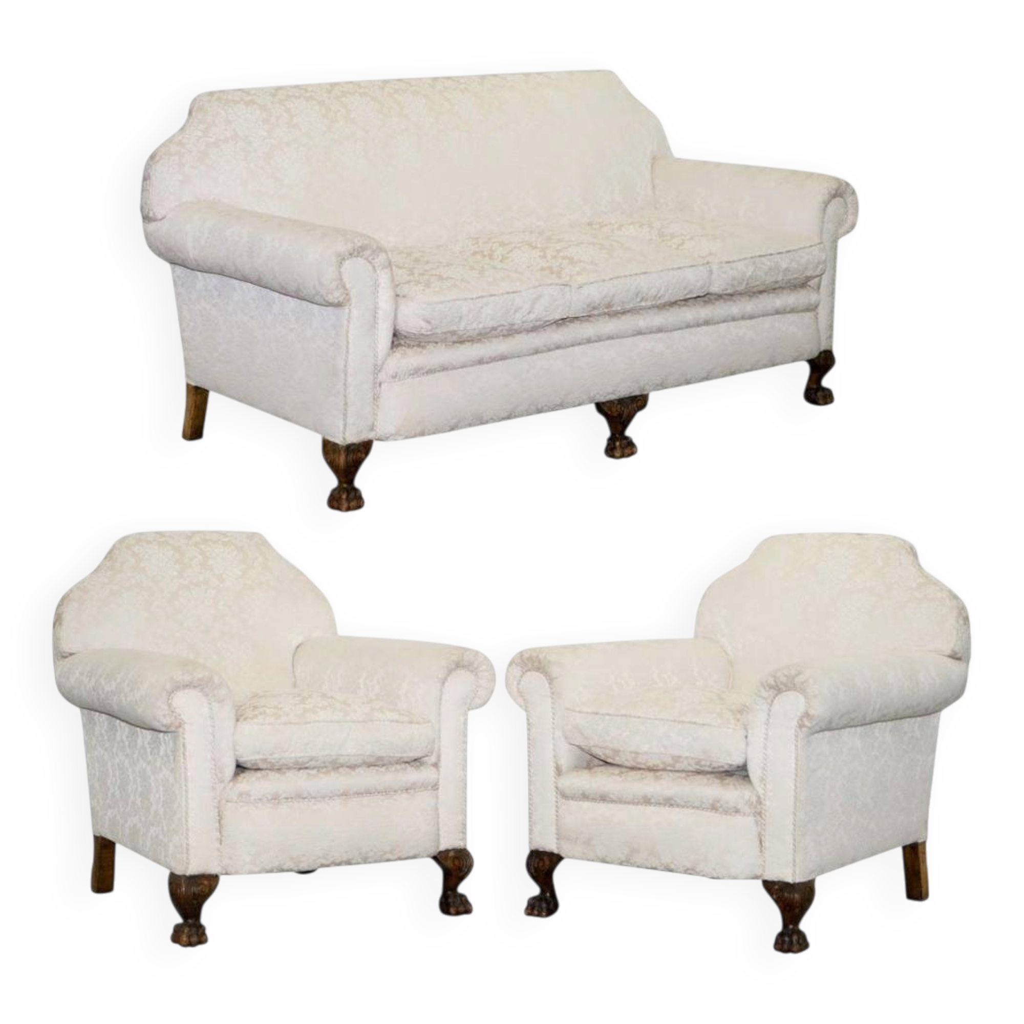 Victorian suite in damask, walnut frame, legs carved in lion's paw.