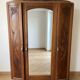 Antique carved wooden wardrobe with mirror