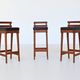 Erik Buck set of three bar stools in teak and leather Dyrlund Denmark 1960