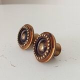 Pair of antique furniture knobs in gilded brass.