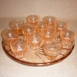 12 shot glasses on pink glass tray