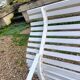 Old garden bench with metal legs and wooden slats