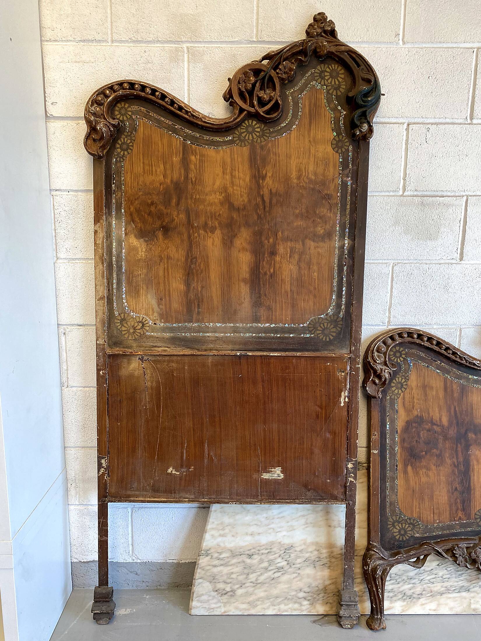 Pair of Art Nouveau cast iron headboards, Italy circa 1900