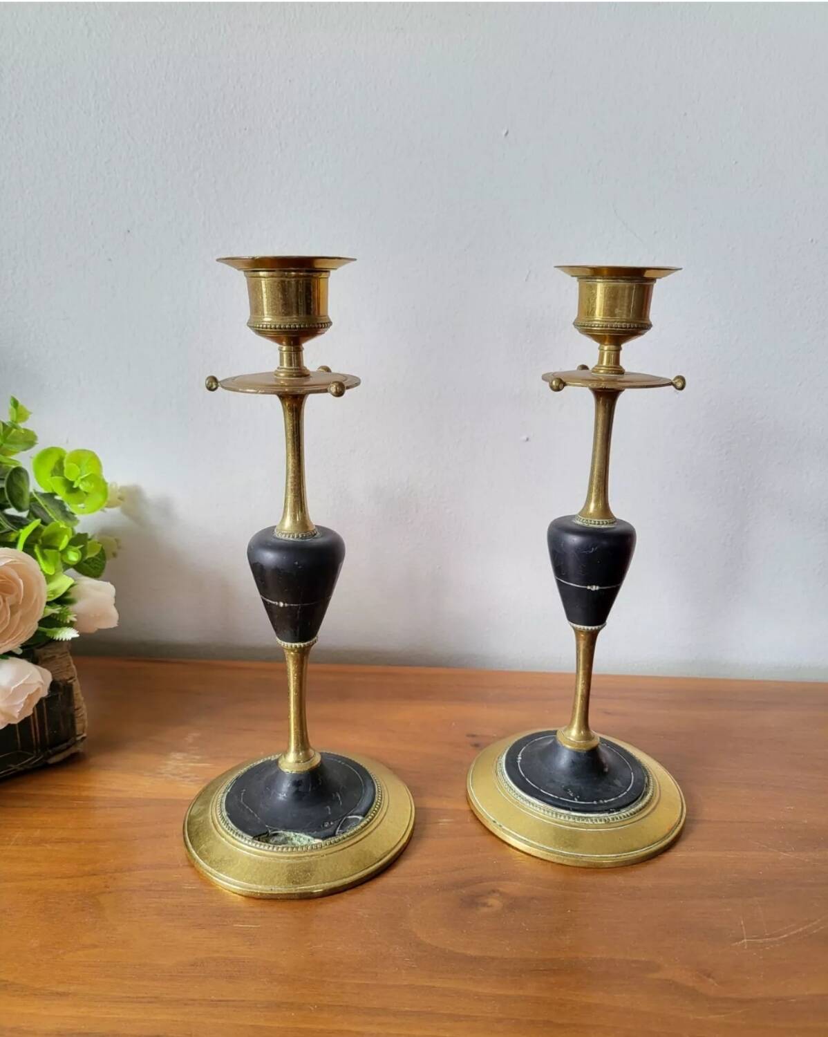 Pair of brass and black hard stone candlesticks