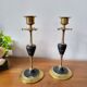 Pair of brass and black hard stone candlesticks