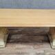 Table en pierre avec piètement à décor de protomes de lions ailés