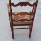 Straw-lined arm chair