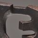 Gimmik 1 sandstone wall sculpture