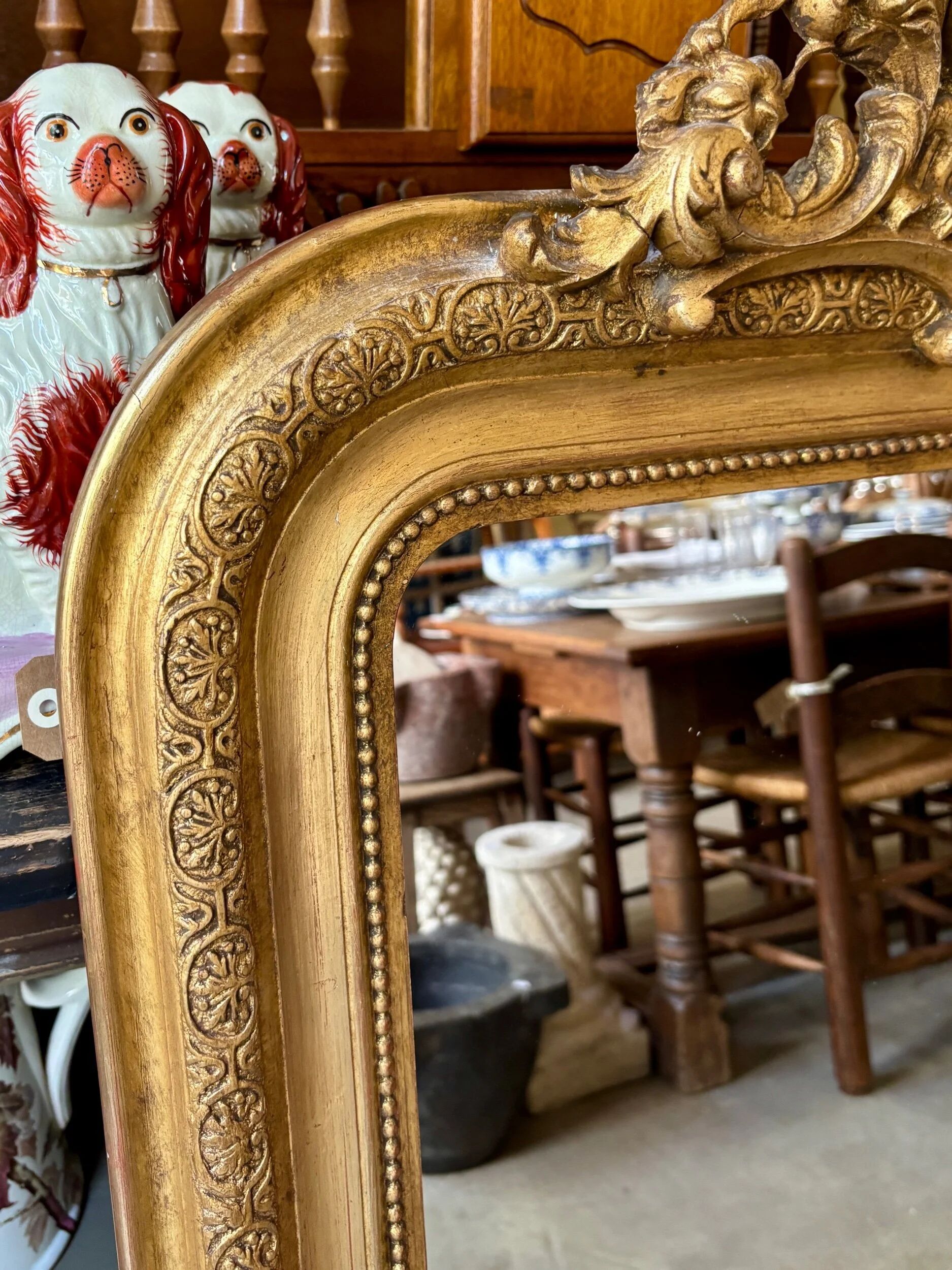 Gold sculpted and moulded stucco trumeau mirror 113 x 78 cm