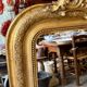 Gold sculpted and moulded stucco trumeau mirror 113 x 78 cm