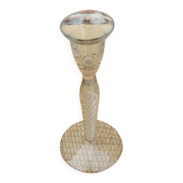 Old twisted transparent glass candlestick