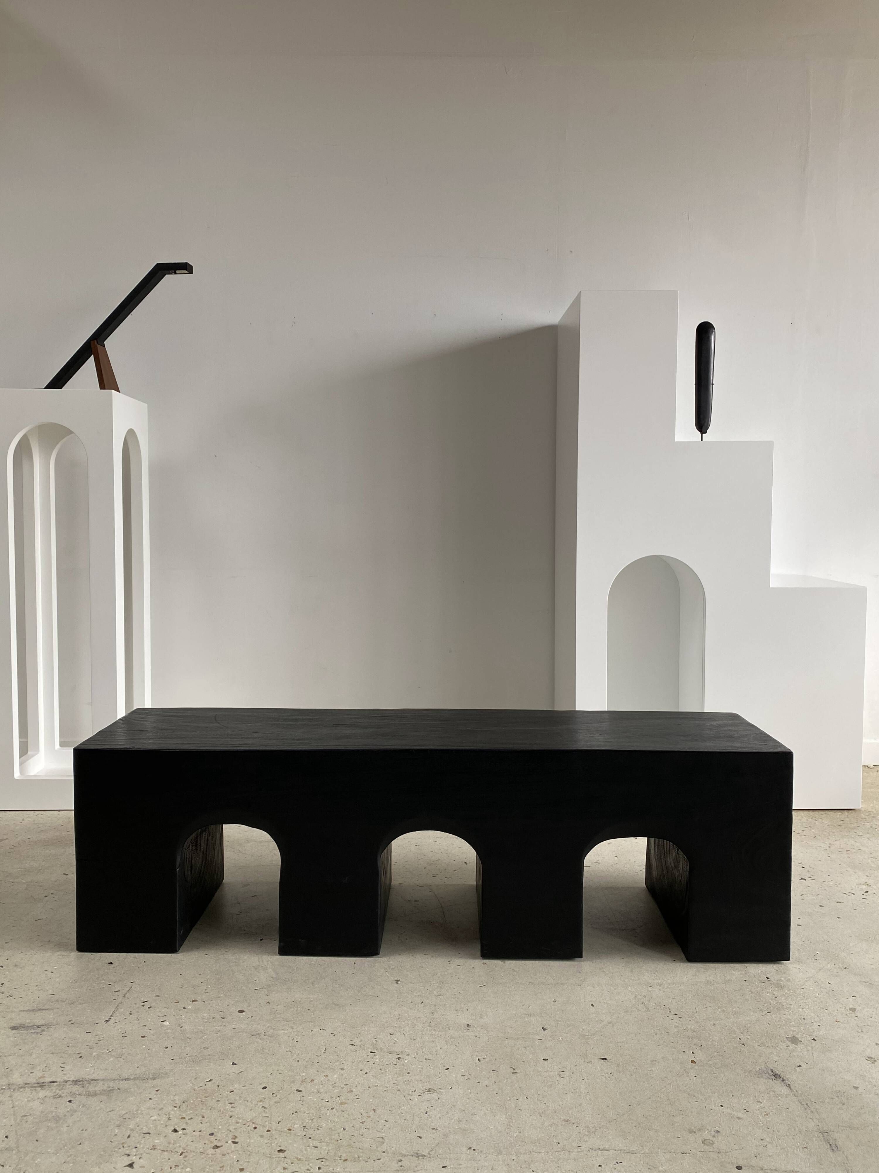 Bench in solid monoxyl wood, carved base in 3 arches - Black color