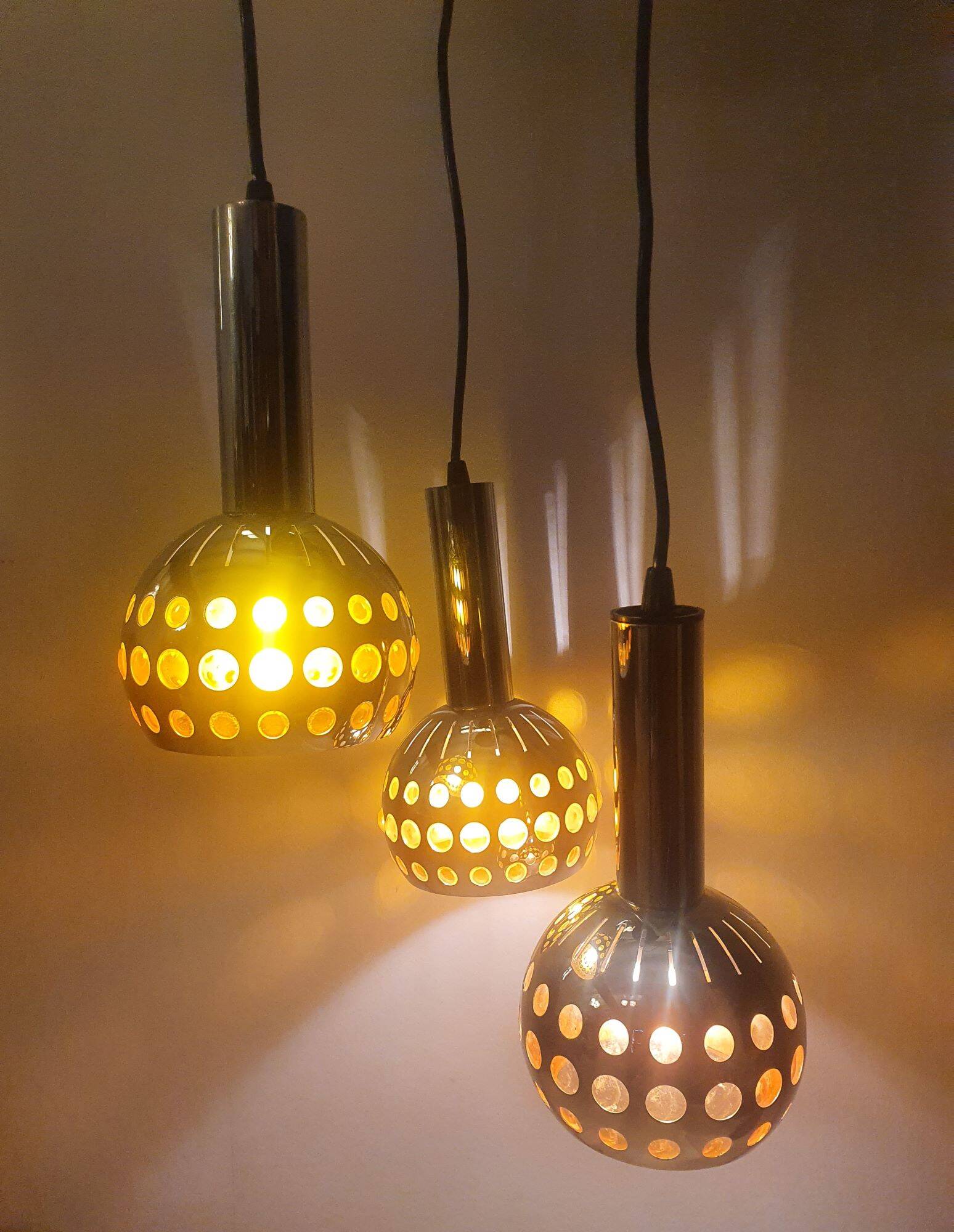 Raak three-light space age orange pendant lamp, 1970s, Netherlands