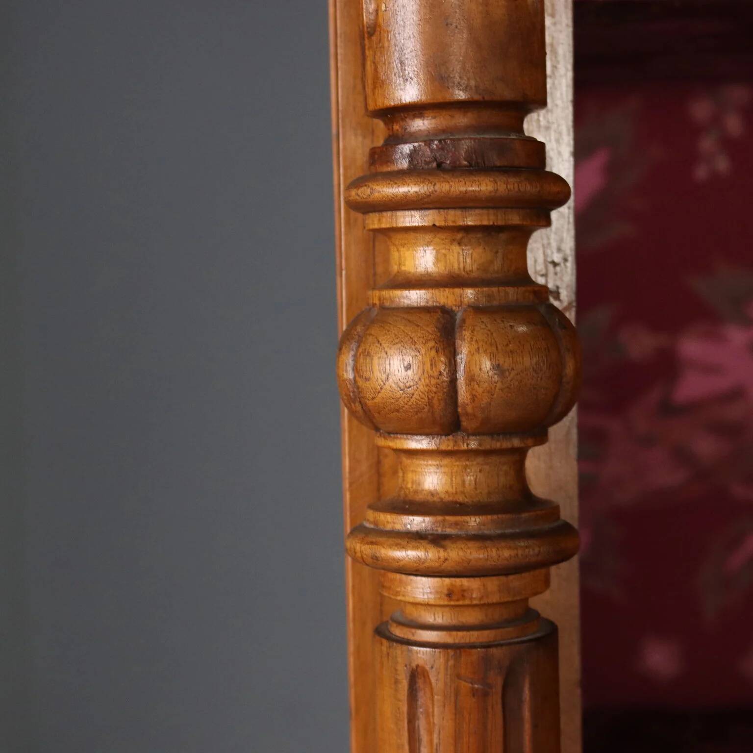 Antique walnut wardrobe with glass and carvings, Italy, 19th century.