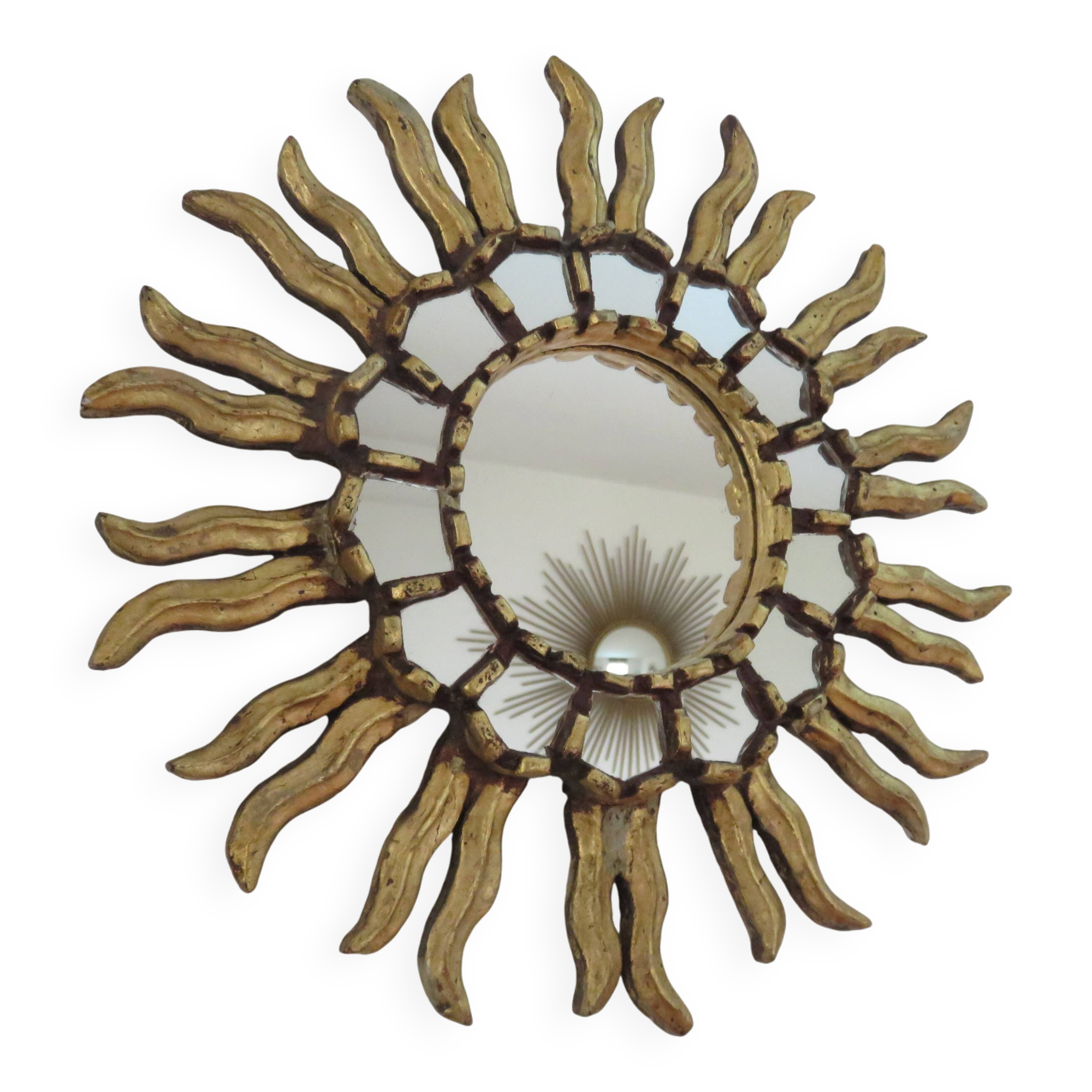 Miroir soleil en bois doré avec incrustations début XXème