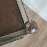 Pedestal table in leather and metal
