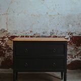 Commode noire à 2 tiroirs, plateau en bois brut et pied fuselés