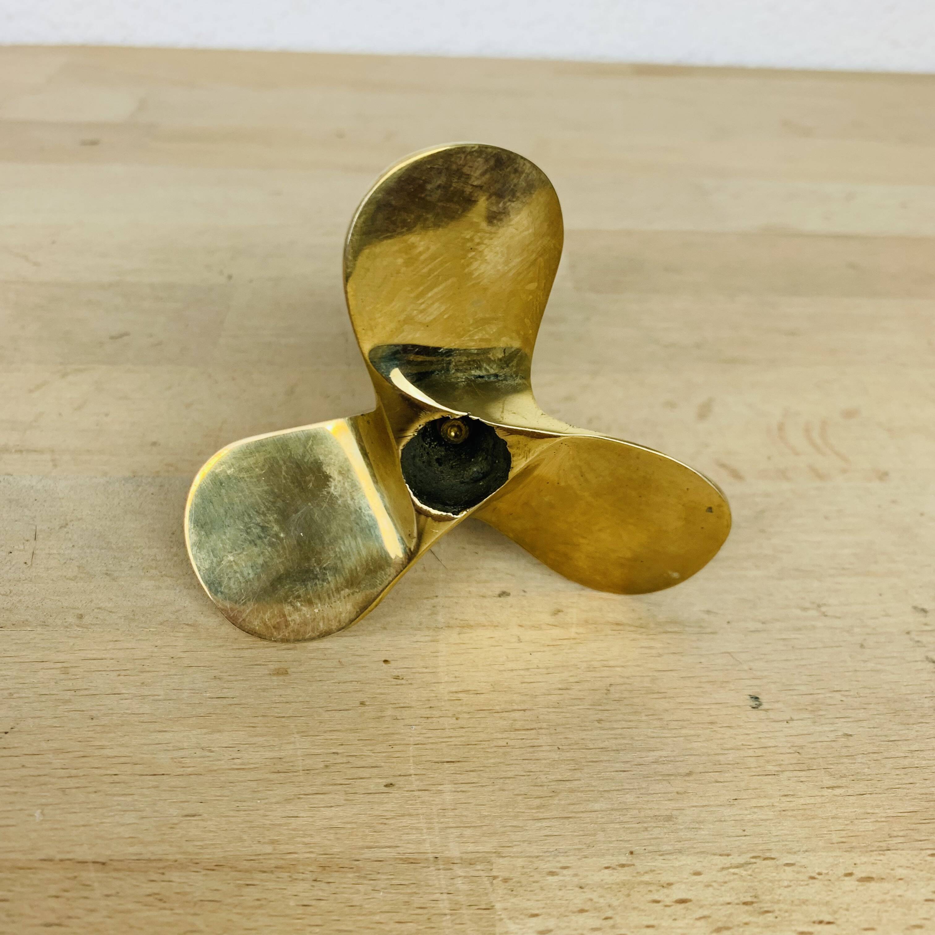 Golden brass propeller candle holder
