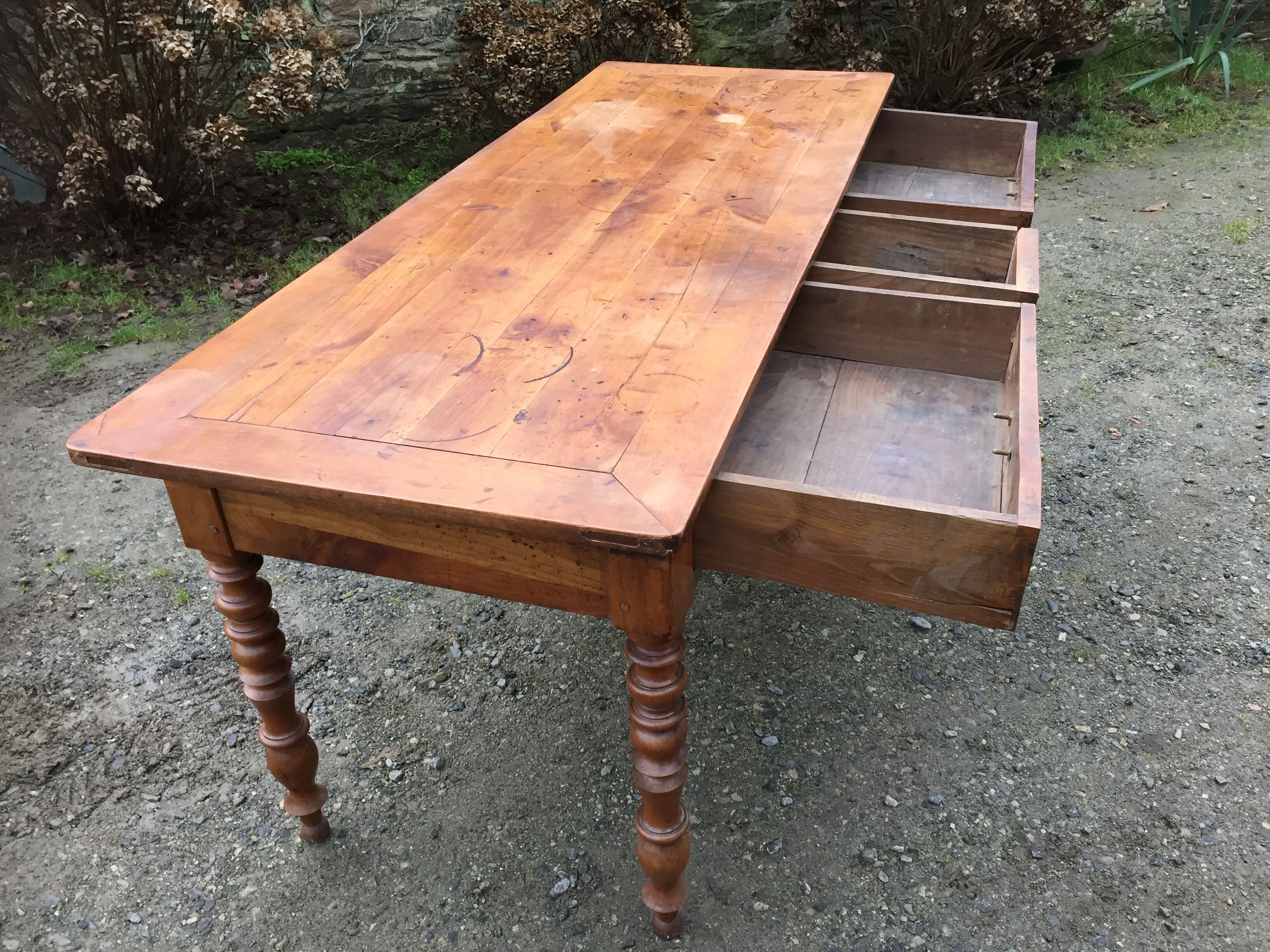 Old cherry farmhouse table with 3 drawers and turned legs