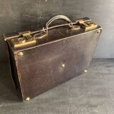 Small black grained leather travel suitcase from the 1920s