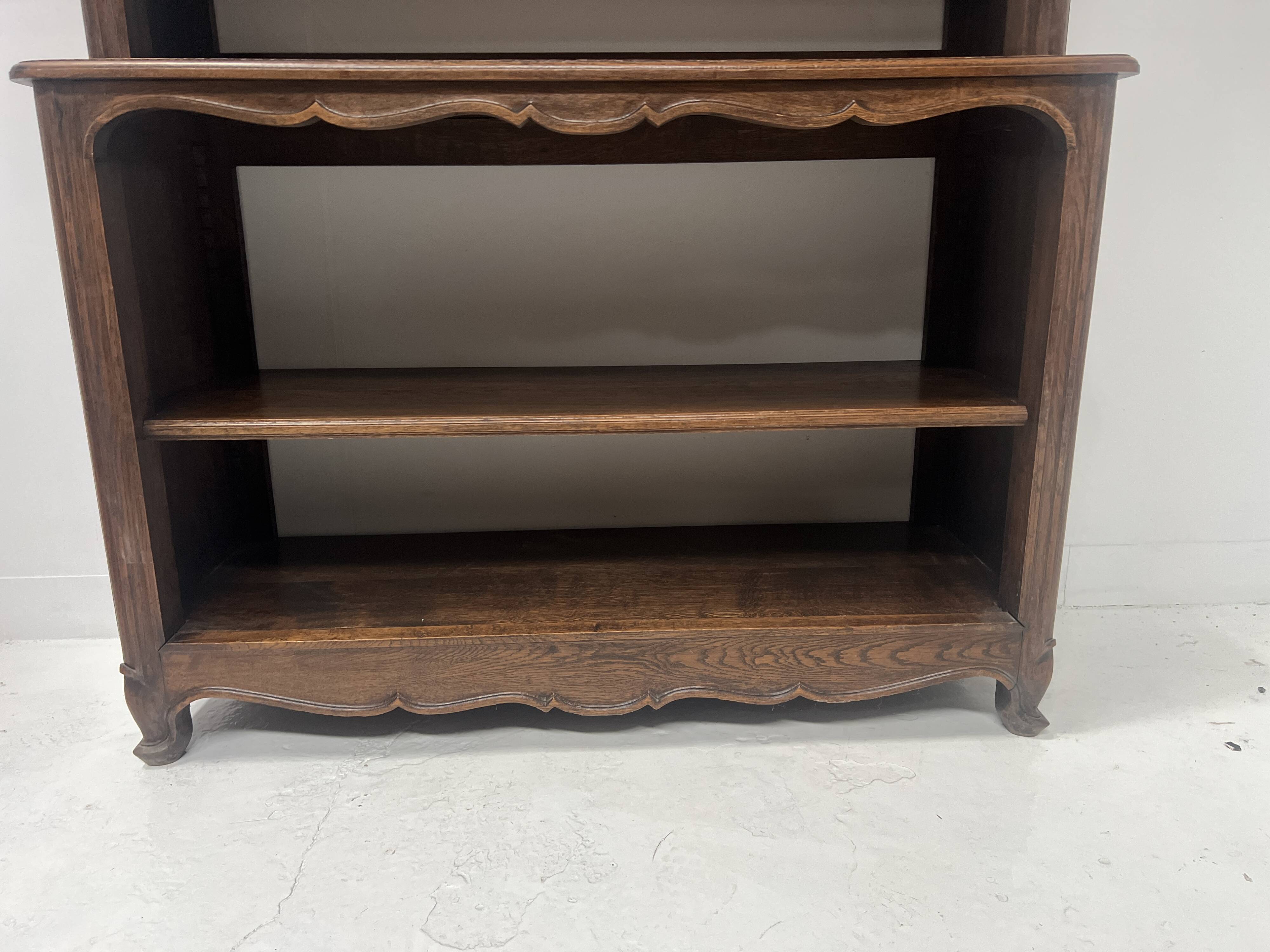 Wall library in two sections in Louis XV style made of solid oak, 20th century.