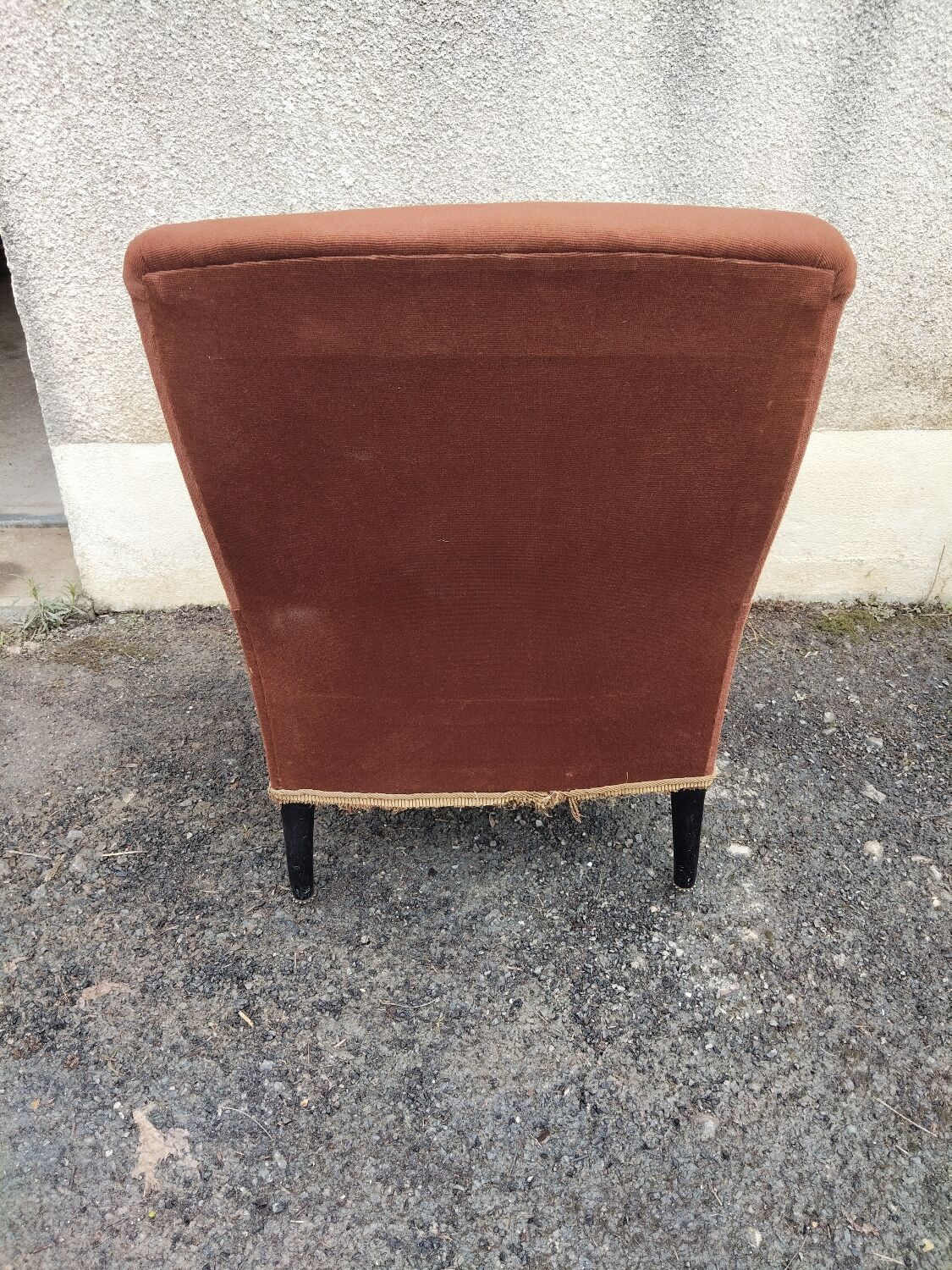 Antique brown velvet tub chair – turned legs and brass rings.