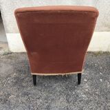 Antique brown velvet tub chair – turned legs and brass rings.