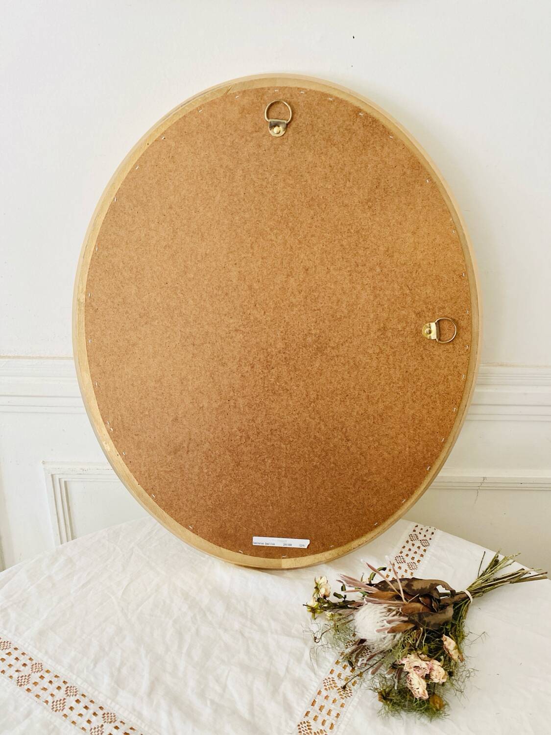 Oval wall mirror in gilded wood