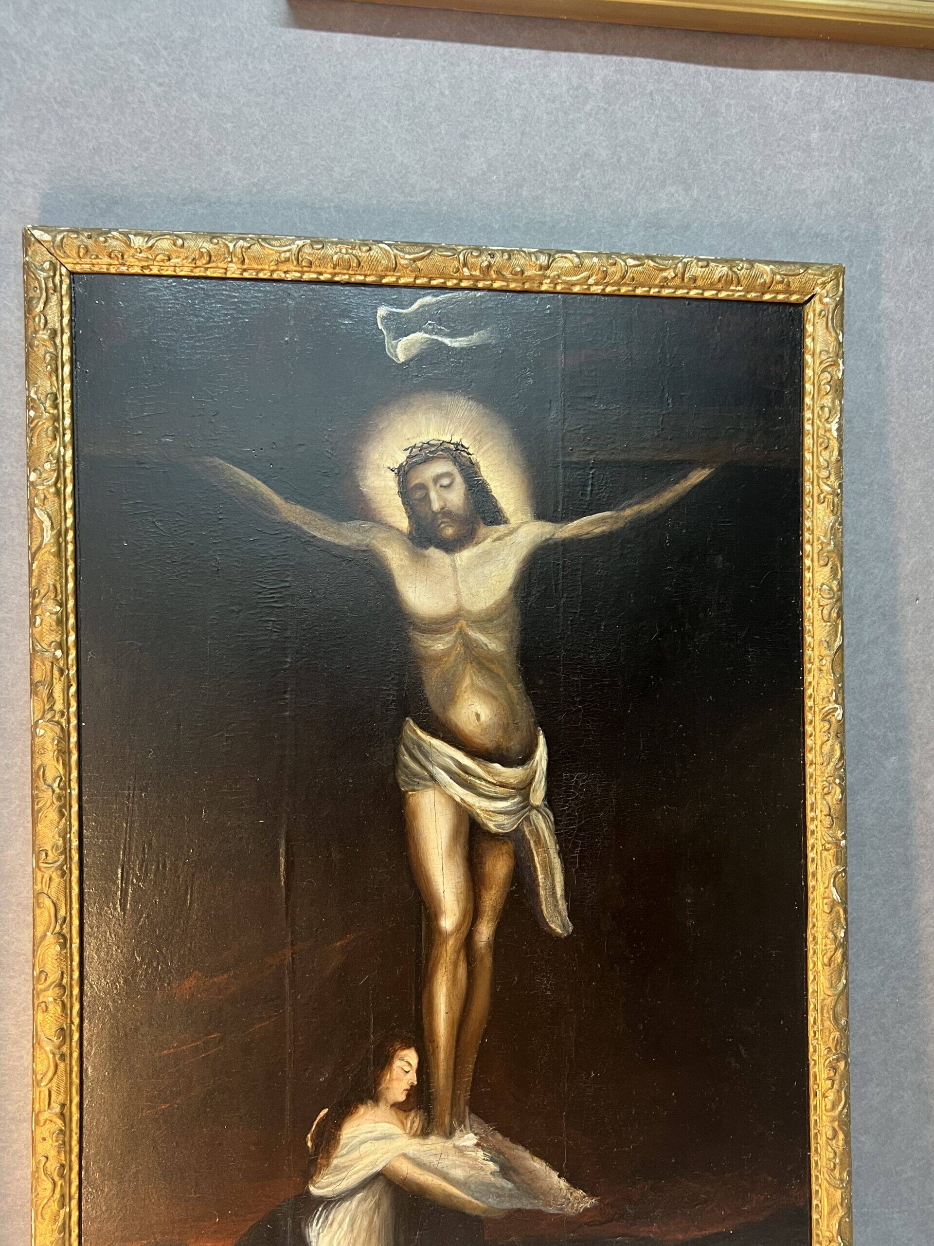 Beautiful religious work from the 17th century, oil on panel representing Christ on his cross with Mary Magdalene at his feet